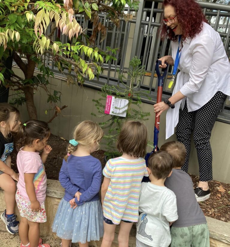 Tree planting at Mikarie with the kids watching