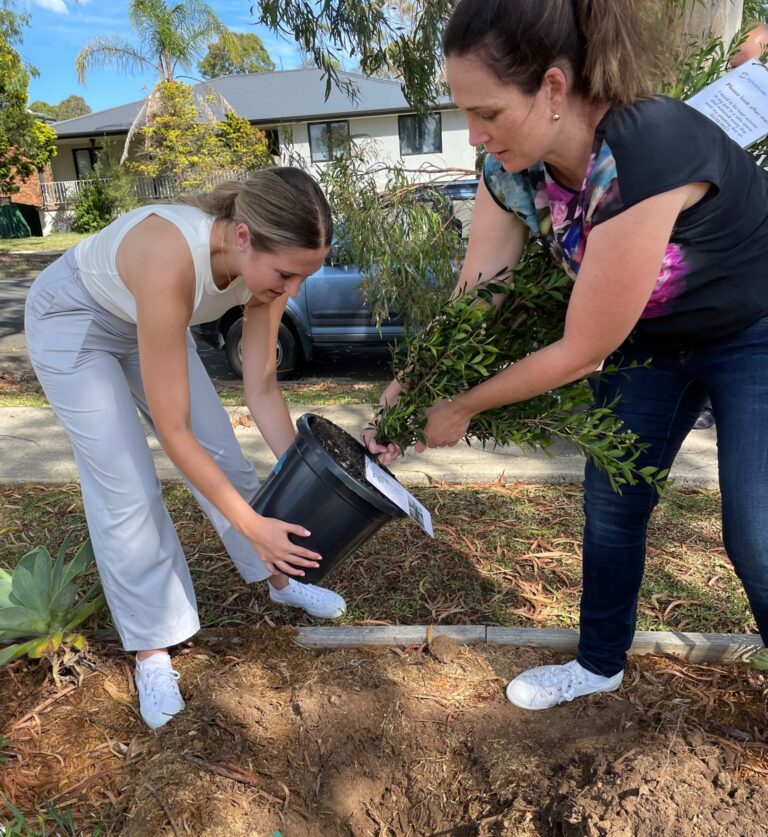 Sylvanvale 75th Year Update Tree planting with two staff members