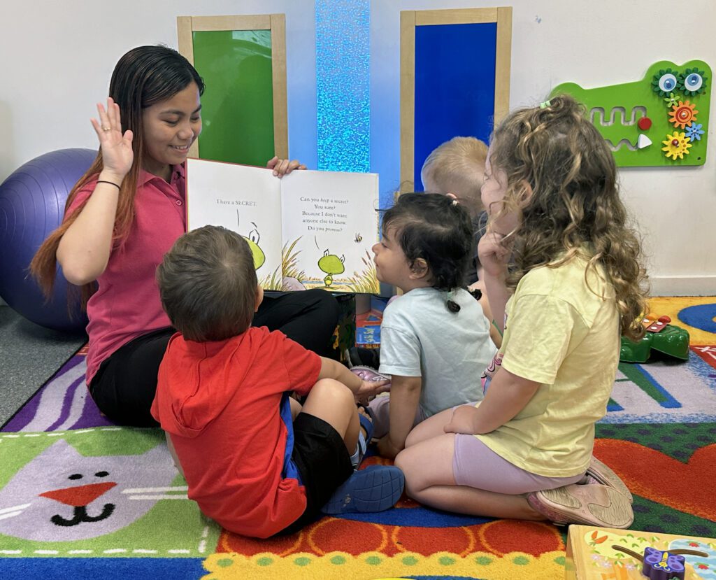 Educator reading to children