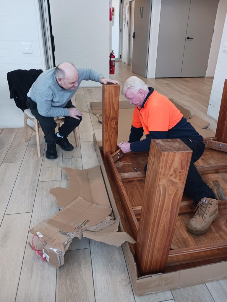 Colin with a Sylvanvale participant putting a table together